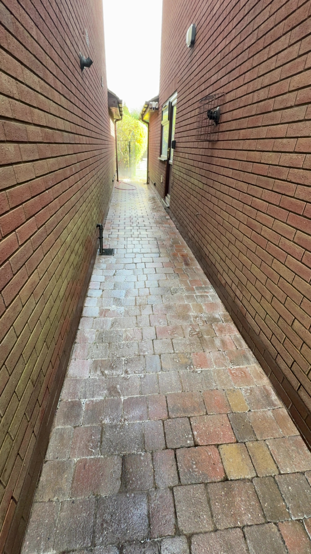 Cleaned block paved side alley path