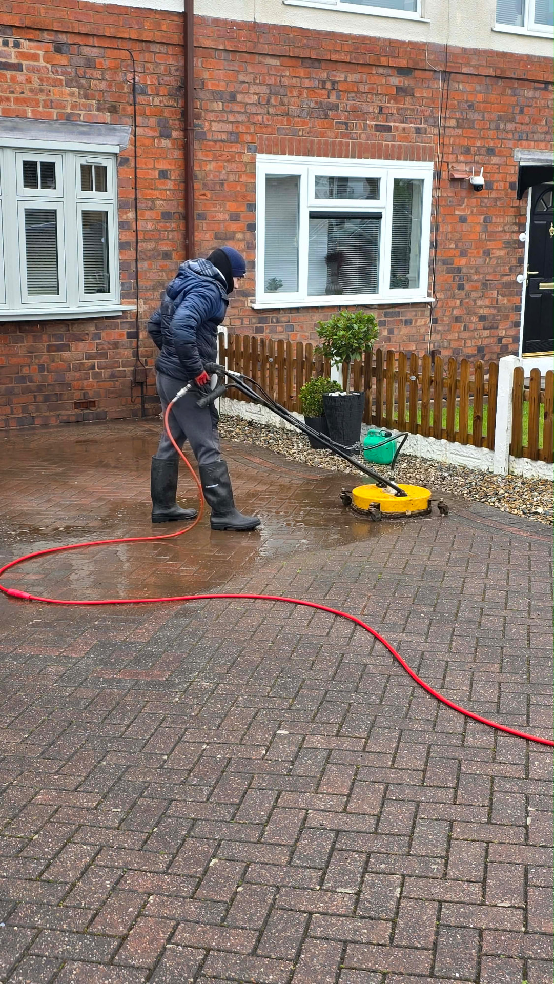 Rotary surface cleaner restoring a brick driveway