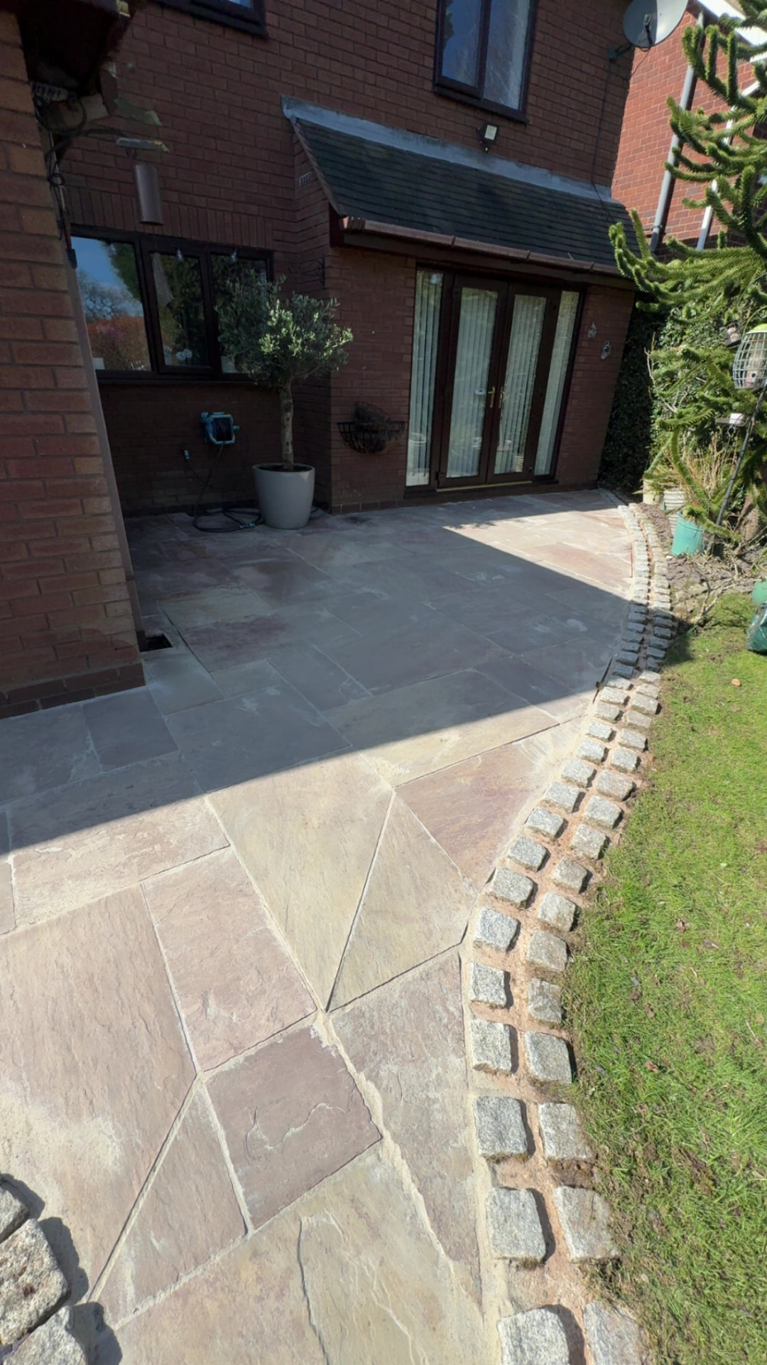 Clean sandstone patio after exterior cleaning